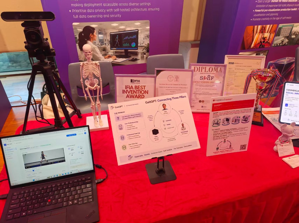 GaitGPT LUX booth with awards, diploma, and depth camera