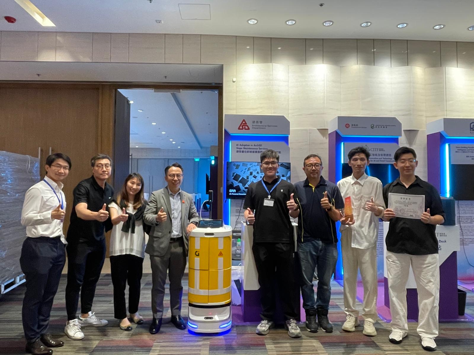 SRR team with senior Architectural Services Department representatives at the CIC AI Award booth